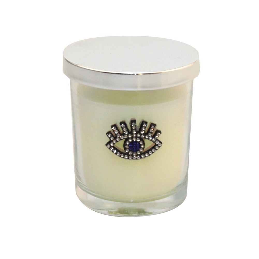 Bougie argent œil parfum patchouli