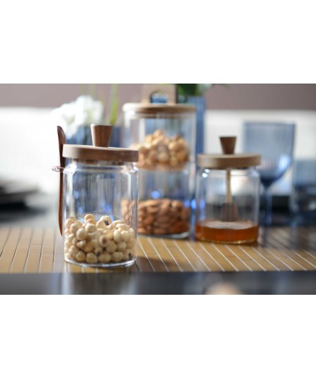 Glass sugar pot with lid and wooden spoon