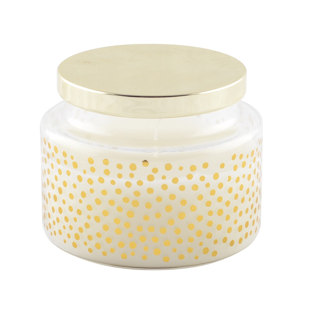 Round candle with small dots and golden cover sage scent