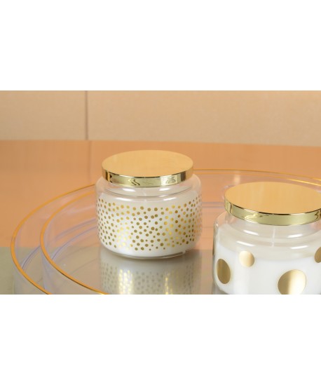 Round candle with small dots and golden cover sage scent