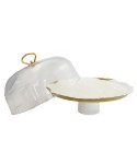 White porcelain cake dome with golden rim and cake server