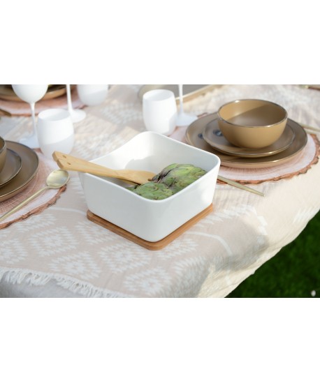 Porcelain and bamboo salad bowl with utensils