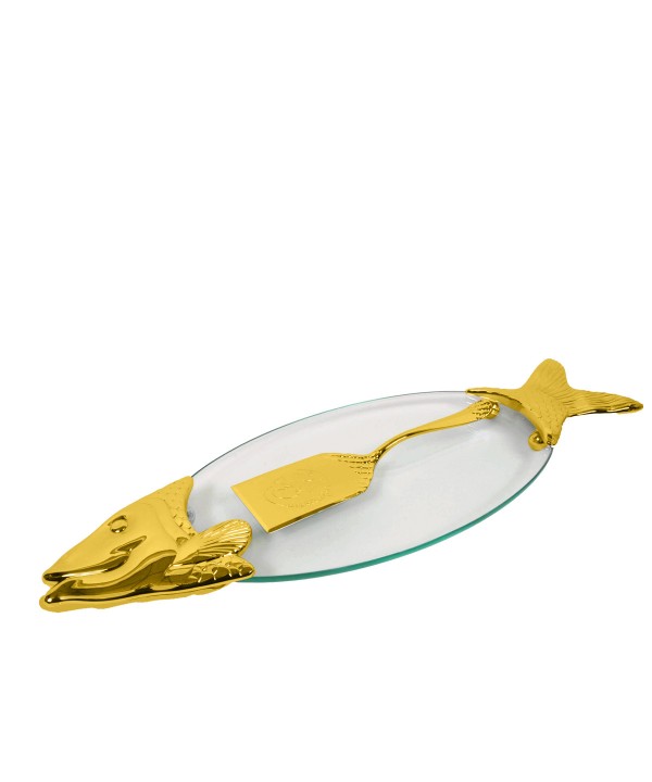 Fish dish with golden serving scoop